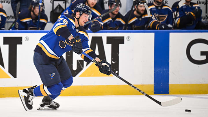 May 2, 2025; St. Louis, Missouri, USA; St. Louis Blues right wing Zack Bolduc (76) passes the puck against the Winnipeg Jets during the first period in game six of the first round of the 2025 Stanley Cup Playoffs at Enterprise Center. Mandatory Credit: Connor Hamilton-Imagn Images