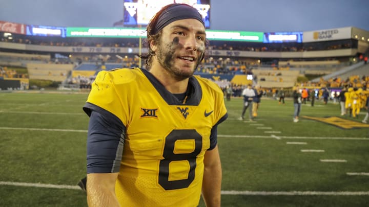 Sep 23, 2023; Morgantown, West Virginia, USA; West Virginia Mountaineers quarterback Nicco Marchiol (8) celebrates after defeating the Texas Tech Red Raiders at Mountaineer Field at Milan Puskar Stadium. Mandatory Credit: Ben Queen-Imagn Images