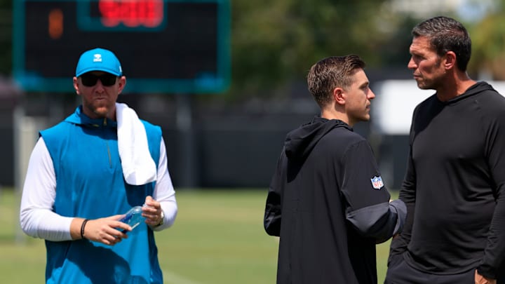 From left, Jacksonville Jaguars head coach Liam Coen, general manager James Gladstone and Tony Boselli, executive vice president of football operations, talk after an NFL training camp session at the Miller Electric Center, Thursday, Aug. 14, 2025 in Jacksonville, Fla.