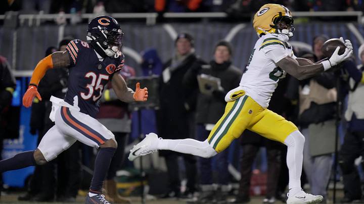 Former Green Bay Packers wide receiver Romeo Doubs (87) catches a touchdown pass after blowing past former Chicago Bears safety C.J. Gardner-Johnson (35), who was in coverage on Doubs, during the third quarter of an NFL football game between the Packers and the Bears on Saturday, December 20, 2025, at iconic Soldier Field in Chicago, Illinois. Despite the defensive miscue, Chicago defeated Green Bay 22-16 in overtime.