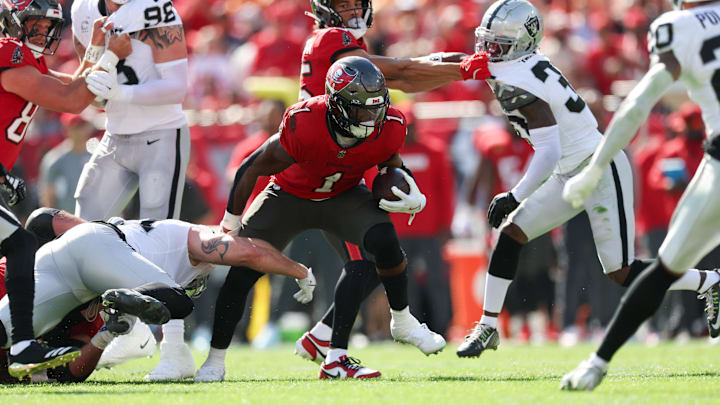 Dec 8, 2024; Tampa, Florida, USA; Tampa Bay Buccaneers running back Rachaad White (1) runs with the ball against the Las Vegas Raiders in the first quarter at Raymond James Stadium. Mandatory Credit: Nathan Ray Seebeck-Imagn Images