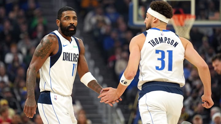 Dec 15, 2024; San Francisco, California, USA; Dallas Mavericks guard Kyrie Irving (11) is congratulated by guard Klay Thompson (31) after scoring against the Golden State Warriors during the first quarter at Chase Center. Mandatory Credit: Darren Yamashita-Imagn Images