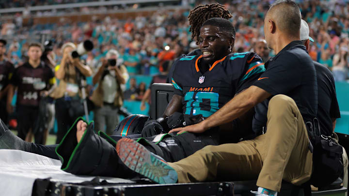 Miami Dolphins wide receiver Tyreek Hill (10) reacts after being placed on a medical cart against the New York Jets during the second half at Hard Rock Stadium. Miami Dolphins wide receiver Tyreek Hill (10) reacts after being placed on a medical cart against the New York Jets during the second half at Hard Rock Stadium.