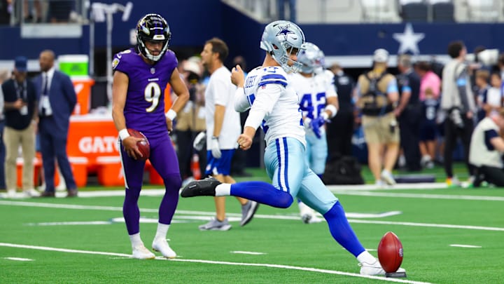 Sep 22, 2024; Arlington, Texas, USA;  Dallas Cowboys place kicker Brandon Aubrey (17) kicks a ball in front of  Baltimore Ravens place kicker Justin Tucker (9) before the game at AT&T Stadium. 