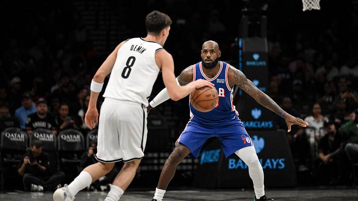 Oct 8, 2026; Brooklyn, New York, USA;  Philadelphia 76ers forward Lebron James (23) defends Brooklyn Nets guard Egor Demin (8) during the first half at Barclays Center.  Mandatory Credit: John Jones-Imagn Images