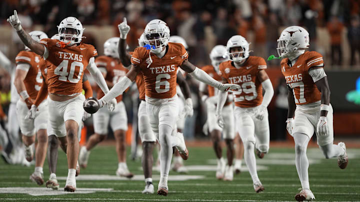 Texas defensive back Kobe Black and teammates react after he made an interception against Texas A&M.