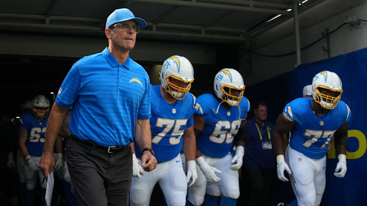 Aug 16, 2025; Inglewood, California, USA; Los Angeles Chargers coach Jim Harbaugh, center Bradley Bozeman (75), guard Jamaree Salyer (68) and guard Zion Johnson (77) enter the field before the game against the Los Angeles Rams at SoFi Stadium. Mandatory Credit: Kirby Lee-Imagn Images