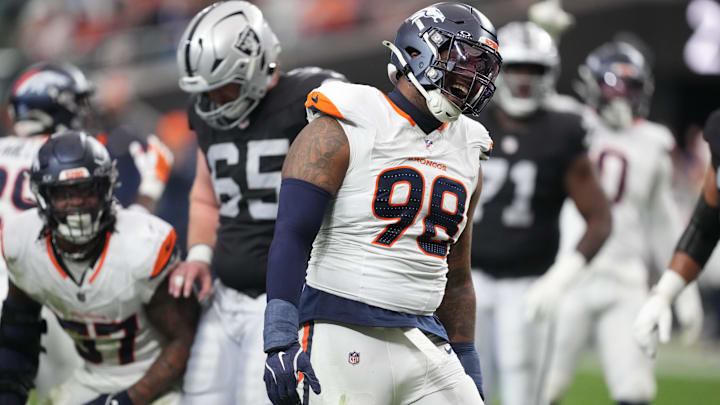 Dec 7, 2025; Paradise, Nevada, USA;  Denver Broncos defensive end John Franklin-Myers (98) reacts after a sack against the Las Vegas Raiders during the first half at Allegiant Stadium. Mandatory Credit: Kirby Lee-Imagn Images