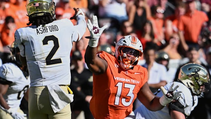 Oct 4, 2025; Blacksburg, Va.; Wake Forest quarterback Robby Ashford (2) throws a pass against Virginia Tech defensive lineman Kemari Copeland (13).