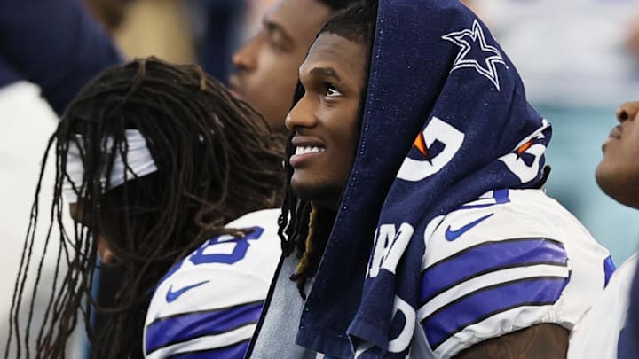 Dallas Cowboys receiver CeeDee Lamb smiles while on the bench in the second half against the Atlanta Falcons.