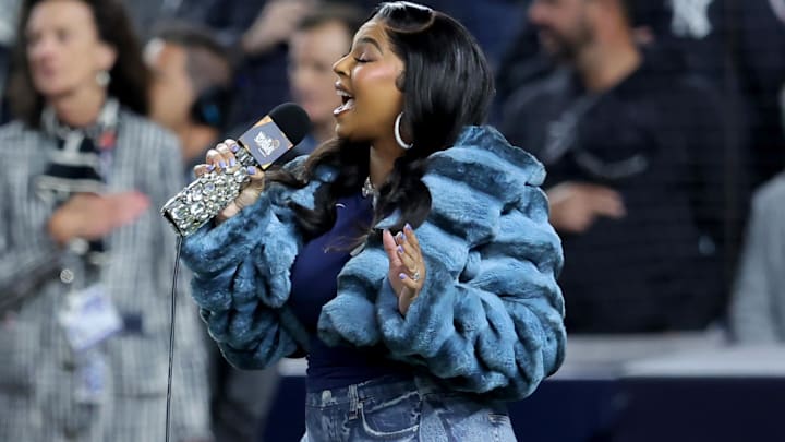 Ashanti  performs the national anthem before game four of the 2024 MLB World Series between the Los Angeles Dodgers and New York Yankees at Yankee Stadium.