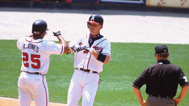 Atlanta Braves left fielder Chipper Jones (10) reacts with teammate Andruw Jones (25) Atlanta Braves left fielder Chipper Jones (10) reacts with teammate Andruw Jones (25)