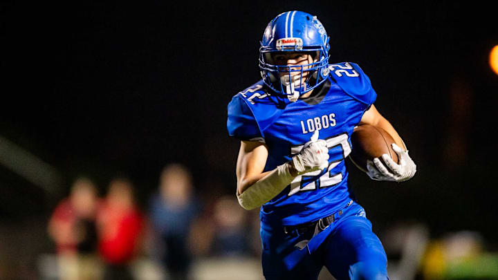 Hayden Lobos running back runs with the ball against the Mogollon Mustangs during the 1A state championship game at Coronado High School's football field in Scottsdale on Nov. 11, 2023.