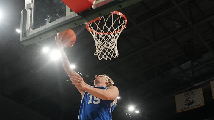 Feb 10, 2026; Waco, Texas, USA;  BYU Cougars guard Richie Saunders (15) scores a layup ahead of Baylor Bears guard Cameron Carr (43) during the second half at Paul and Alejandra Foster Pavilion.