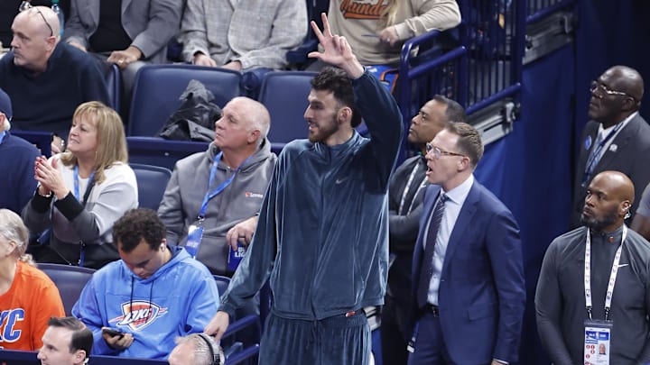 Oklahoma City Thunder forward Chet Holmgren gestures from the bench after his team scores against the Dallas Mavericks during the third quarter at Paycom Center on December 10, 2024. Oklahoma City Thunder forward Chet Holmgren gestures from the bench after his team scores against the Dallas Mavericks during the third quarter at Paycom Center on December 10, 2024.