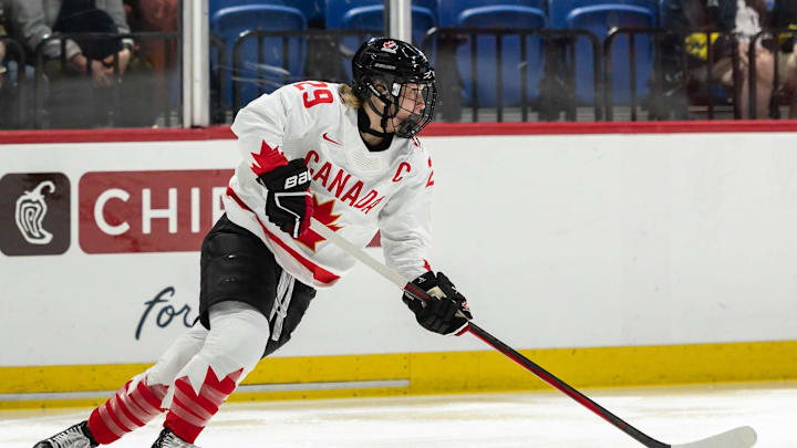 Canada's Marie-Philip Poulin looks for a pass at the Adirondack Bank Center in Utica, N.Y. on April 5, 2024.