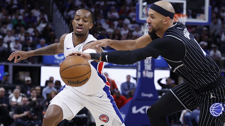 Apr 22, 2026; Detroit, Michigan, USA; Orlando Magic guard Jalen Suggs (4) knocks the ball from Detroit Pistons guard Daniss Jenkins (24) in the second half during game two of the first round of the 2026 NBA Playoffs at Little Caesars Arena. Mandatory Credit: Rick Osentoski-Imagn Images