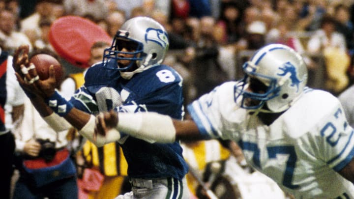 Dec 2, 1984; Seattle, WA, USA; FILE PHOTO; Seattle Seahawks receiver Daryl Turner (81) catches a pass as he is defended by Detroit Lions defensive back Bobby Watkins (27) at the Kingdome. The Seahawks defeated the Lions 38-17. Mandatory Credit: Darryl Norenberg-USA TODAY Sports Dec 2, 1984; Seattle, WA, USA; FILE PHOTO; Seattle Seahawks receiver Daryl Turner (81) catches a pass as he is defended by Detroit Lions defensive back Bobby Watkins (27) at the Kingdome. The Seahawks defeated the Lions 38-17. Mandatory Credit: Darryl Norenberg-USA TODAY Sports