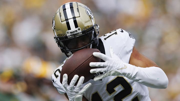 Sep 24, 2023; Green Bay, Wisconsin, USA;  New Orleans Saints wide receiver Chris Olave (12) catches a pass during the second quarter against the Green Bay Packers at Lambeau Field. Mandatory Credit: Jeff Hanisch-Imagn Images