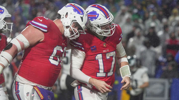 Buffalo Bills center Connor McGovern celebrates with Buffalo Bills quarterback Josh Allen after a touchdown, the team’s first of the game, in the fourth quarter against the Philadelphia Eagles.