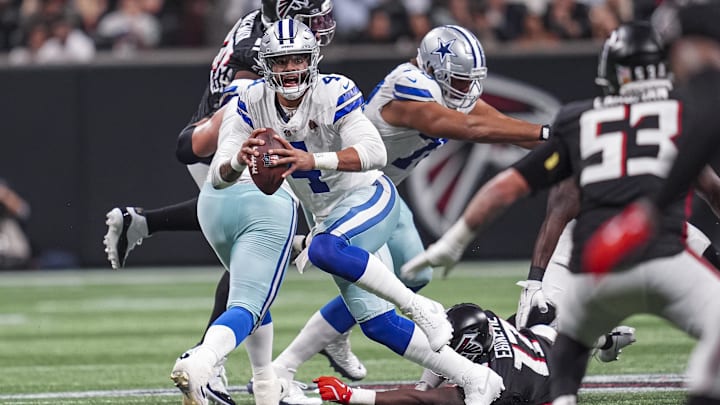 Nov 3, 2024; Atlanta, Georgia, USA; Dallas Cowboys quarterback Dak Prescott (4) runs out of the pocket against the Atlanta Falcons during the second half at Mercedes-Benz Stadium. Mandatory Credit: Dale Zanine-Imagn Images