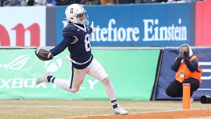 Dec 27, 2025; Bronx, NY, USA; Penn State Nittany Lions wide receiver Trebor Pena (8) scores on a touchdown reception during the second half of the 2025 Pinstripe Bowl against the Clemson Tigers at Yankee Stadium. Mandatory Credit: Vincent Carchietta-Imagn Images