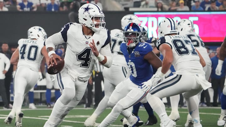 Dallas Cowboys quarterback Dak Prescott rolls out against the New York Giants.