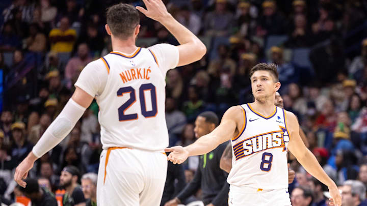 Jan 19, 2024; New Orleans, Louisiana, USA;  Phoenix Suns guard Grayson Allen (8) slaps hands with center Jusuf Nurkic (20) after a play against the New Orleans Pelicans during the second half at Smoothie King Center. Mandatory Credit: Stephen Lew-Imagn Images
