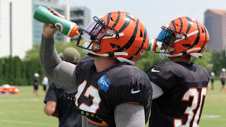 Bengals safeties Clayton Fejedelem (42) and Jesse Bates III (30) drink water on a hot day at the Cincinnati Bengals practice at Paul Brown Stadium Tuesday, August 6, 2019.

20190806 Bengalspractice0109