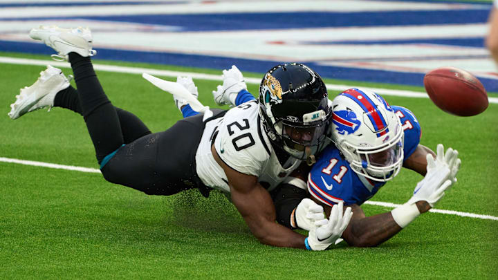 Oct 8, 2023; London, United Kingdom;  Jacksonville Jaguars safety Daniel Thomas (20) defends Buffalo Bills wide receiver Deonte Harty (11) during the second half of an NFL International Series game at Tottenham Hotspur Stadium. Mandatory Credit: Peter van den Berg-Imagn Images