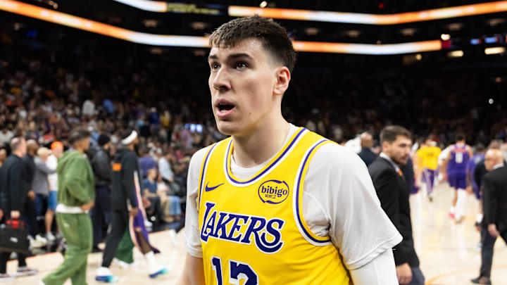 Feb 26, 2026; Phoenix, Arizona, USA; Los Angeles Lakers forward Jake LaRavia (12) against the Phoenix Suns at Mortgage Matchup Center. Mandatory Credit: Mark J. Rebilas-Imagn Images