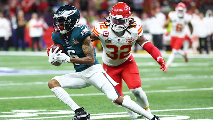 Feb 9, 2025; New Orleans, LA, USA; Philadelphia Eagles wide receiver DeVonta Smith (6) makes a catch against Kansas City Chiefs linebacker Nick Bolton (32) in the first quarter in Super Bowl LIX at Ceasars Superdome. Mandatory Credit: Mark J. Rebilas-Imagn Images
