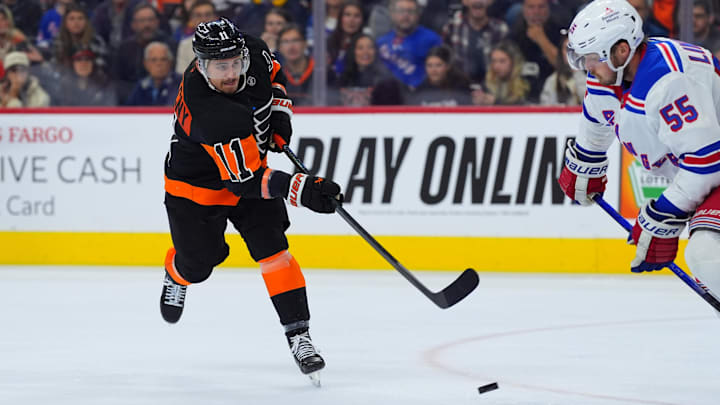 Nov 29, 2024; Philadelphia, Pennsylvania, USA; Philadelphia Flyers right wing Travis Konecny (11) shoots the puck against the New York Rangers in the third period at Wells Fargo Center. Mandatory Credit: Kyle Ross-Imagn Images