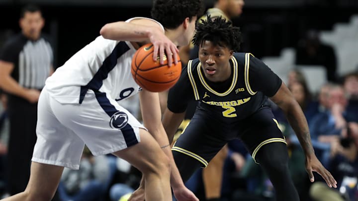 Jan 6, 2026; University Park, Pennsylvania, USA; Michigan Wolverines guard LJ Cason (2) defends Penn State Nittany Lions guard Melih Tunca (9) during the second half at Bryce Jordan Center. Mandatory Credit: Matthew O'Haren-Imagn Images