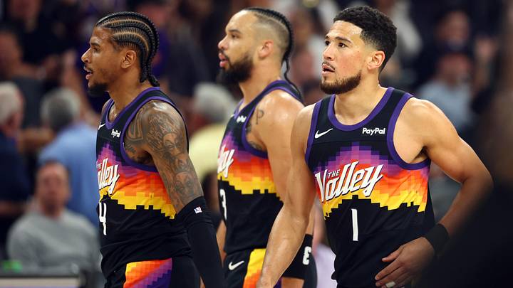 Apr 7, 2026; Phoenix, Arizona, USA; Phoenix Suns guard Jalen Green (4), forward Dillon Brooks (3) and guard Devin Booker (1) against the Houston Rockets at Mortgage Matchup Center. Mandatory Credit: Mark J. Rebilas-Imagn Images