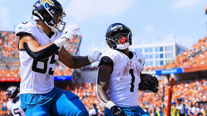 Sep 14, 2025; Cincinnati, Ohio, USA; Jacksonville Jaguars tight end Brenton Strange (85) reacts after running back Travis Etienne Jr. (1) scores a touchdown in the second half against the Cincinnati Bengals at Paycor Stadium.