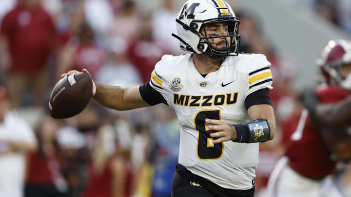 Oct 26, 2024; Tuscaloosa, Alabama, USA;  Missouri Tigers quarterback Drew Pyne (6) rolls out to pass against the Alabama Crimson Tide during the second half at Bryant-Denny Stadium. Mandatory Credit: Butch Dill-Imagn Images