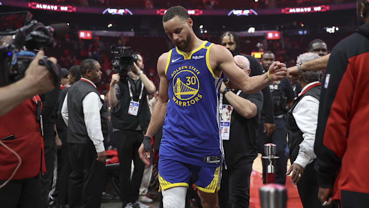 Golden State Warriors guard Stephen Curry walks off the court after the game against the Houston Rockets.