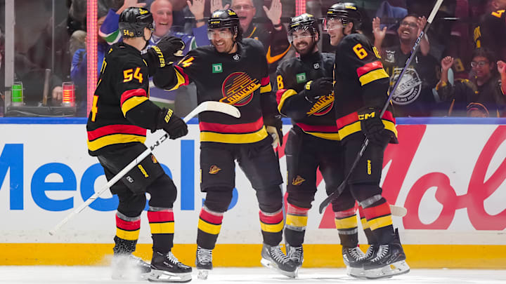 Vancouver Canucks players Kiefer Sherwood, Conor Garland, Aatu Raty and Brock Boeser