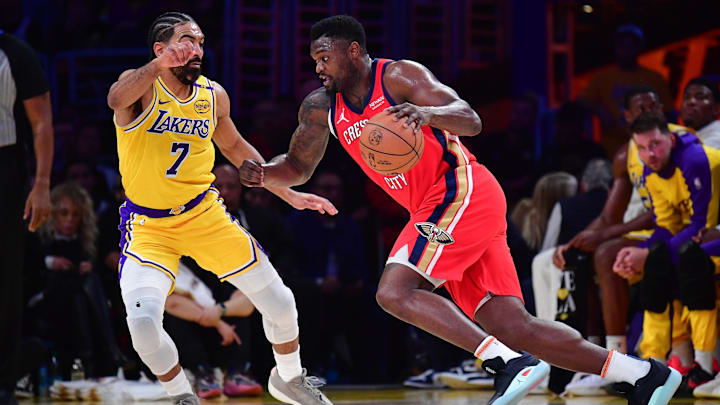 Mar 4, 2025; Los Angeles, California, USA; New Orleans Pelicans forward Zion Williamson (1) moves the ball against Los Angeles Lakers guard Gabe Vincent (7) during the first half at Crypto.com Arena. Mandatory Credit: Gary A. Vasquez-Imagn Images