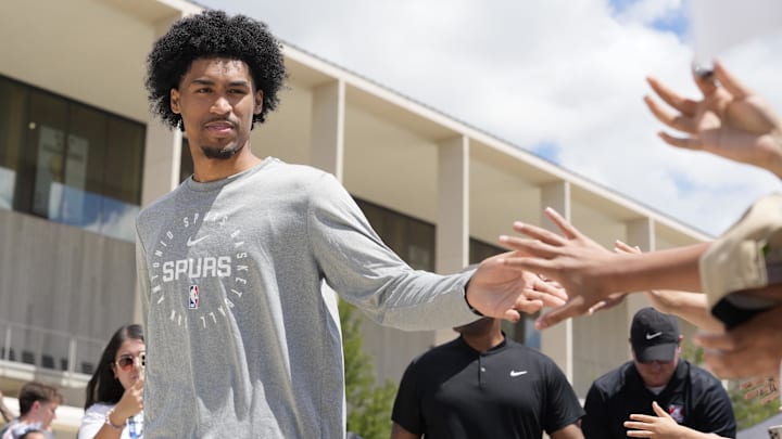 Jun 28, 2025; San Antonio, TX, USA; San Antonio Spurs first round draft pick Dylan Harper (2) greets fans at Victory Capital Performance Center. Mandatory Credit: Scott Wachter-Imagn Images