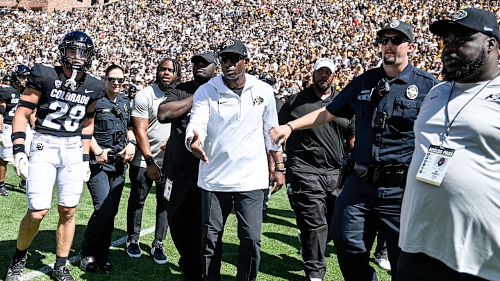 Nebraska football coach Matt Rhule meets Deion Sanders at midfield