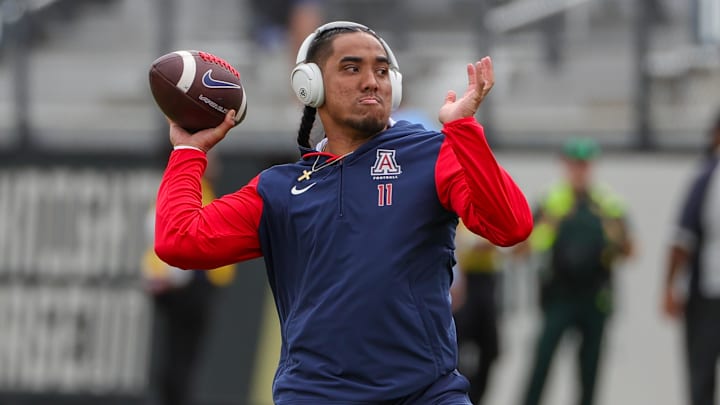 Nov 2, 2024; Orlando, Florida, USA; Arizona Wildcats quarterback Noah Fifita (11) warms up before the game against the UCF Knights at FBC Mortgage Stadium. Mandatory Credit: Mike Watters-Imagn Images