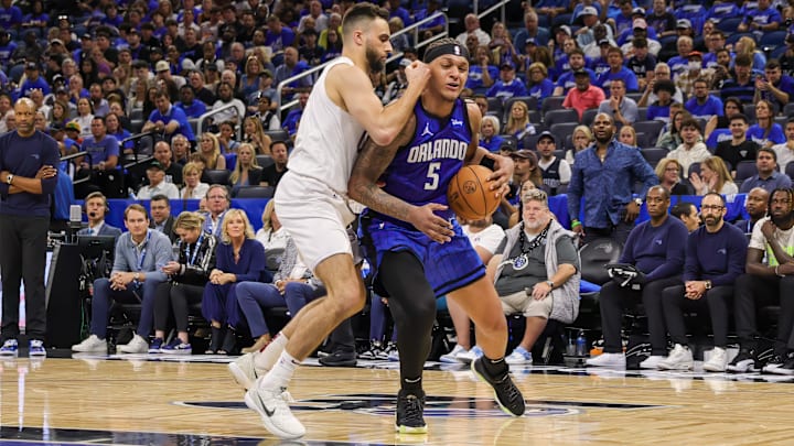 May 3, 2024; Orlando, Florida, USA; Orlando Magic forward Paolo Banchero (5) drives to the basket