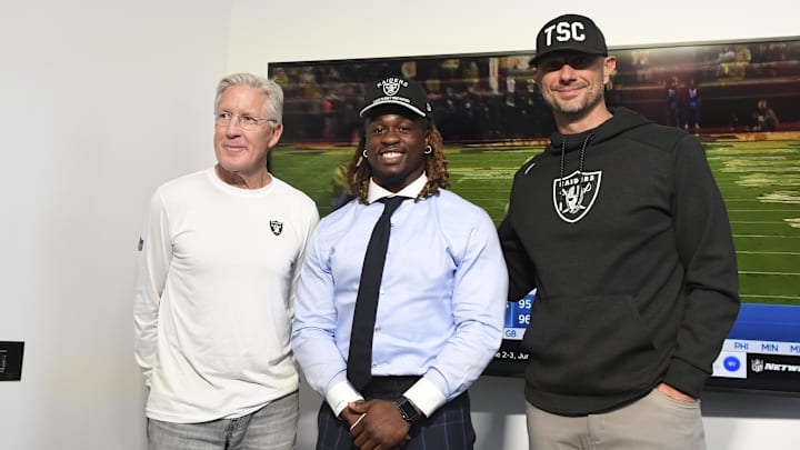 Apr 25, 2025; Henderson, NV, USA; (L-R) Las Vegas Raiders head coach Pete Carroll, Ashton Jeanty and general manager John Spytek pose after a news conference introducing Jeanty as the first round draft pick in the 2025 NFL Draft at Intermountain Health Performance Center. Mandatory Credit: Candice Ward-Imagn Images