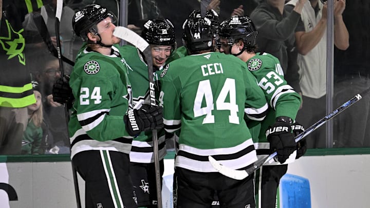Mar 6, 2025; Dallas, Texas, USA; Dallas Stars center Roope Hintz (24) and left wing Jason Robertson (21) and defenseman Cody Ceci (44) and center Wyatt Johnston (53) celebrate the game tying goal scored by Robertson against the Calgary Flames during the third period at the American Airlines Center. Mandatory Credit: Jerome Miron-Imagn Images
