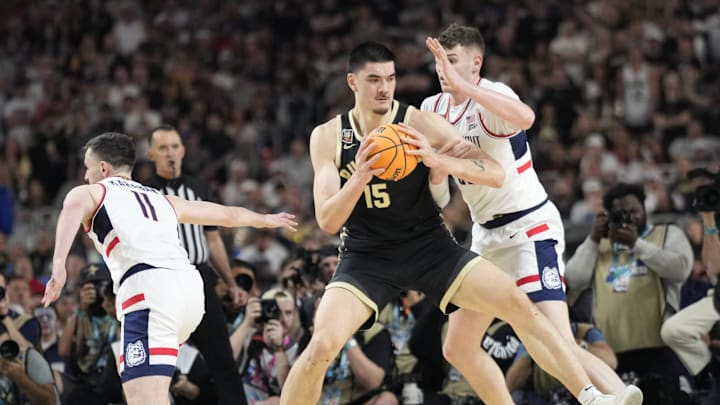 Purdue Boilermakers center Zach Edey (15) is guarded by Connecticut Huskies center Donovan Clingan