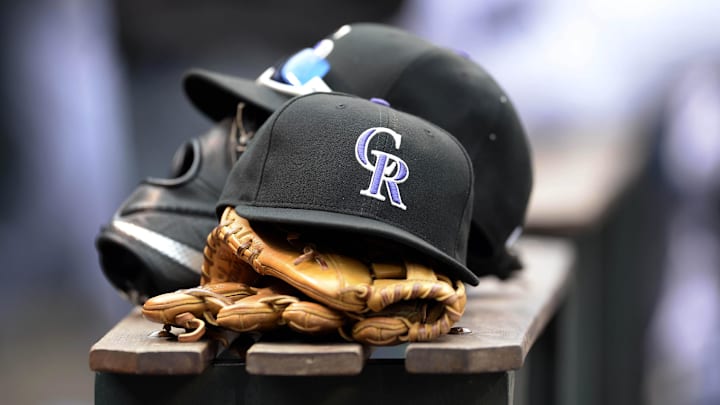 Apr 10, 2015; Denver, CO, USA; General view of Colorado Rockies hats and gloves during the eighth inning against the Chicago Cubs at Coors Field. The Rockies defeated the Cubs 5-1. Mandatory Credit: Ron Chenoy-Imagn Images Apr 10, 2015; Denver, CO, USA; General view of Colorado Rockies hats and gloves during the eighth inning against the Chicago Cubs at Coors Field. The Rockies defeated the Cubs 5-1. Mandatory Credit: Ron Chenoy-Imagn Images
