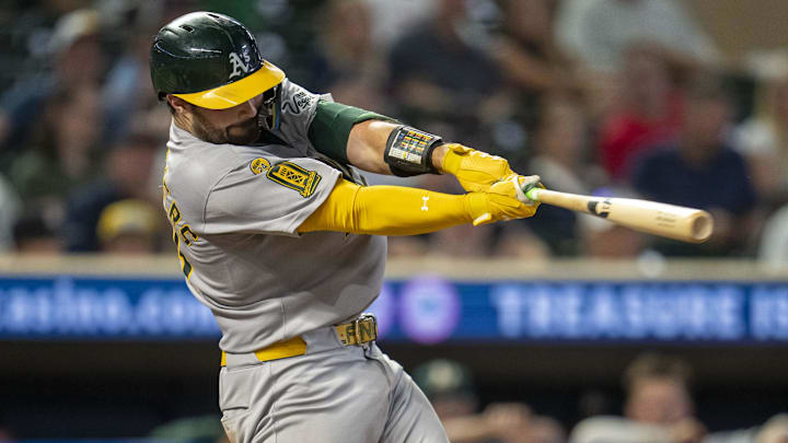 Aug 20, 2025; Minneapolis, Minnesota, USA; Athletics catcher Shea Langeliers (23) hits a two run home run in the tenth inning against the Minnesota Twins  at Target Field. Mandatory Credit: Jesse Johnson-Imagn Images