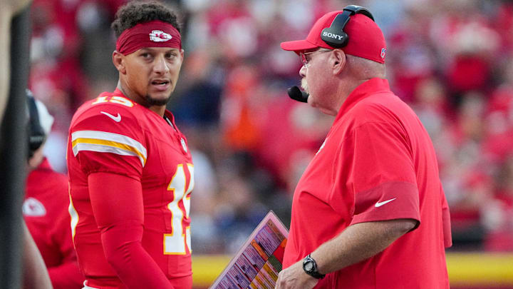 Aug 22, 2025; Kansas City, Missouri, USA; Kansas City Chiefs quarterback Patrick Mahomes (15) talks with head coach Andy Reid after a play against the Chicago Bears during the first half of the game at GEHA Field at Arrowhead Stadium. 
